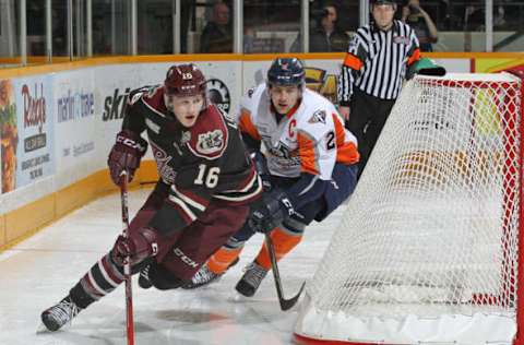 PETERBOROUGH,ON – JANUARY 14: Alex Peters #2 of the Flint Firebirds chases after Steve Lorentz #16 of the Peterborough Petes during an OHL game at the Peterborough Memorial Centre on January 14, 2016 in Peterborough, Ontario, Canada. The Petes defeated the Firebirds 6-1. (Photo by Claus Andersen/Getty Images)