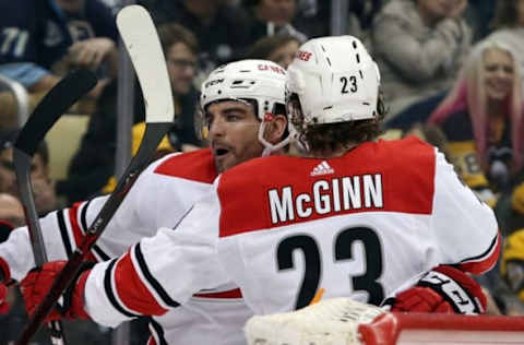 Feb 5, 2019; Pittsburgh, PA, USA; Carolina Hurricanes left wing Jordan Martinook (L) celebrates his goal with right wing Brock McGinn (23) against the Pittsburgh Penguins during the first period at PPG PAINTS Arena. Mandatory Credit: Charles LeClaire-USA TODAY Sports