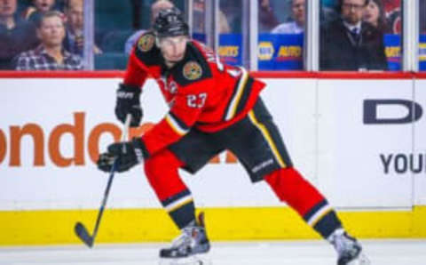 Apr 7, 2016; Calgary, Alberta, CAN; Flames center Sean Monahan (23) controls the puck against the Vancouver Canucks during the second period at Scotiabank Saddledome. Calgary Flames won 7-3. Mandatory Credit: Sergei Belski-USA TODAY Sports