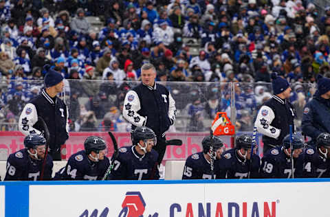 Mar 13, 2022; Hamilton, Ontario, CAN; Toronto Maple Leafs head coach Sheldon Keefe stands in the bench during the first period against the Buffalo Sabres in the 2022 Heritage Classic ice hockey game at Tim Hortons Field. Mandatory Credit: John E. Sokolowski-USA TODAY Sports