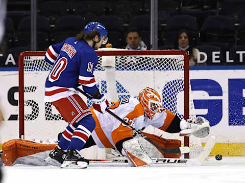 ; Artemi Panarin #10 of the New York Rangers heads for the net as Brian Elliott #37 of the Philadelphia Flyers defends in the first period Credit: Elsa/POOL PHOTOS-USA TODAY Sports