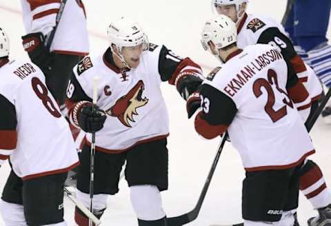 Oct 26, 2015; Toronto, Ontario, CAN; Arizona Coyotes right wing Shane Doan (19) celebrates his goal with defenseman Oliver Ekman-Larsson (23) against the Toronto Maple Leafs at Air Canada Centre. Mandatory Credit: Tom Szczerbowski-USA TODAY Sports