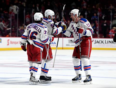 Apr 20, 2017; Montreal, Quebec, CAN; New York Rangers forward Mika Zibanejad (93) reacts with teammates Mats Zuccarello (36) and Kevin Hayes (13) after defeating the Montreal Canadiens 3-2 in overtime in game five of the first round of the 2017 Stanley Cup Playoffs at the Bell Centre. Mandatory Credit: Eric Bolte-USA TODAY Sports