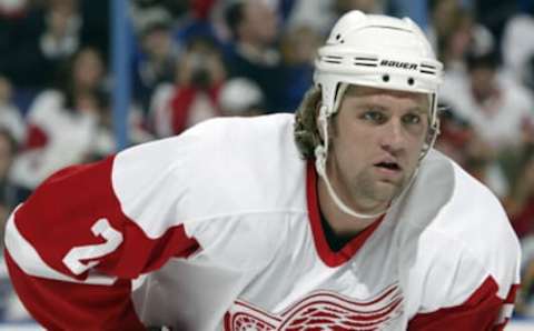 ST. LOUIS – APRIL 1: Derian Hatcher #2 of the Detroit Red Wings lines up for the faceoff during the game against the St. Louis Blues on April 1, 2004 at the Savvis Center in St. Louis, Missouri. The Red Wings defeated the Blues 3-2. (Photo by Elsa/Getty Images)