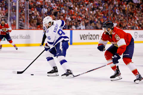 May 19, 2022; Sunrise, Florida, USA; Tampa Bay Lightning right wing Nikita Kucherov (86) moves the puck ahead of Florida Panthers defenseman Aaron Ekblad (5) during the third period in game two of the second round of the 2022 Stanley Cup Playoffs at FLA Live Arena. Mandatory Credit: Sam Navarro-USA TODAY Sports