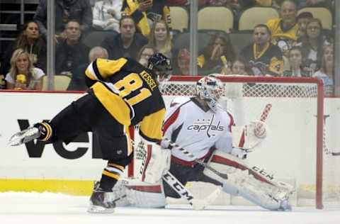 Oct 13, 2016; Pittsburgh, PA, USA; Pittsburgh Penguins right wing Phil Kessel (81) scores the game winning goal against Washington Capitals goalie Braden Holtby (70) in the shootout at the PPG Paints Arena. The Penguins won 3-2 in a shootout. Mandatory Credit: Charles LeClaire-USA TODAY Sports