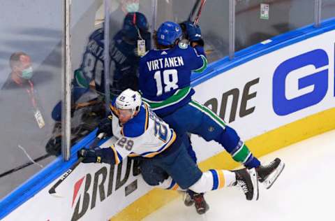 EDMONTON, ALBERTA – AUGUST 16: Jake Virtanen #18 of the Vancouver Canucks checks Vince Dunn #29 of the St. Louis Blues during the first period in Game Four of the Western Conference First Round during the 2020 NHL Stanley Cup Playoffs at Rogers Place on August 16, 2020 in Edmonton, Alberta, Canada. (Photo by Jeff Vinnick/Getty Images)