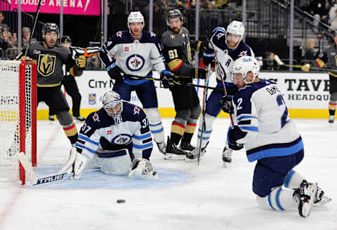 Connor Hellebuyck #37, Dylan DeMelo #2, Winnipeg Jets. (Photo by Ethan Miller/Getty Images)