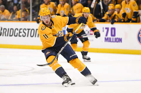 Oct 21, 2023; Nashville, Tennessee, USA; Nashville Predators left wing Samuel Fagemo (11) passes the puck against the San Jose Sharks during the third period at Bridgestone Arena. Mandatory Credit: Steve Roberts-USA TODAY Sports