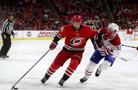 RALEIGH, NC – MARCH 24: Sebastian Aho #20 of the Carolina Hurricanes controls the puck away from Victor Mete #53 of the Montreal Canadiens during an NHL game on March 24, 2019 at PNC Arena in Raleigh, North Carolina. (Photo by Gregg Forwerck/NHLI via Getty Images)