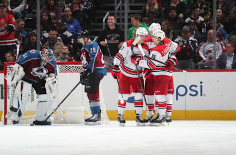 DENVER, CO – MARCH 11: Members of the Carolina Hurricanes celebrate a goal against the Colorado Avalanche at the Pepsi Center on March 11, 2019 in Denver, Colorado. The Hurricanes defeated the Avalanche 3-0. (Photo by Michael Martin/NHLI via Getty Images)