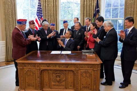 President Barack Obama and guests after signing a bill to grant the Congressional Gold Medal to the 442nd Regiment and 100th Battalion.