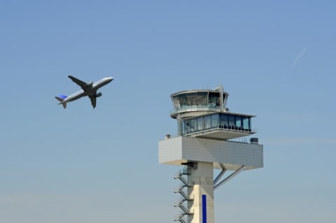 A shot of an airport traffic control tower.