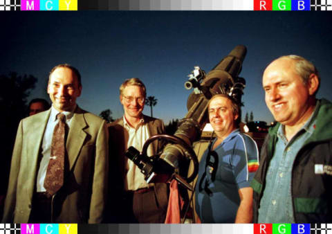 Comet hunters (L to R): David Levy, Dr. Don Yeomans, Dr. Alan Hale and Thomas Bopp pose next to a telescope during a public viewing of the Hale-Bopp and Wild-2 comets.