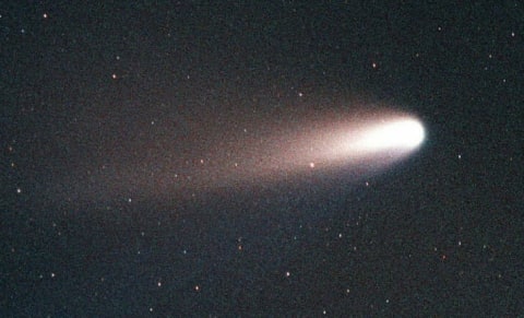 Comet Hale-Bopp streaks through the sky over Merrit Island, Florida, south of Kennedy Space Center.