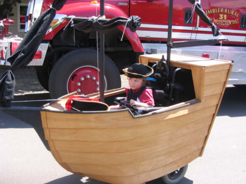 A custom pirate ship Halloween costume, created by Magic Wheelchair founder Ryan Weimer for his son, Keaton.