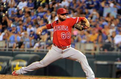 Jul 25, 2016; Kansas City, MO, USA; Los Angeles Angels relief pitcher Cam Bedrosian (68) delivers a pitch against the Kansas City Royals in the eighth inning at Kauffman Stadium. The Angels won 6-2. Mandatory Credit: John Rieger-USA TODAY Sports