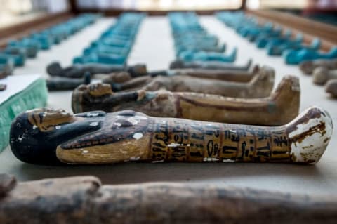 Small funerary statues discovered in the tomb were carved in wood, clay, and limestone.