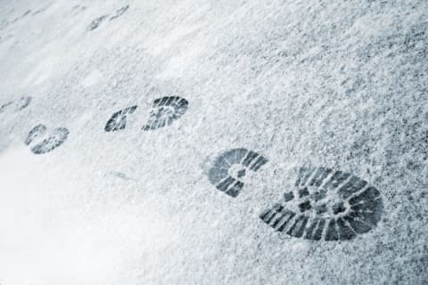 Boot prints in the snow.