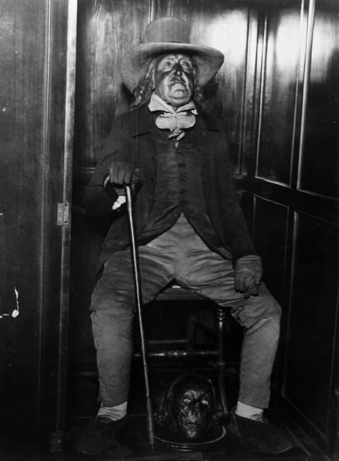 Jeremy Bentham's auto-icon, with his mummified head between his feet, circa 1950