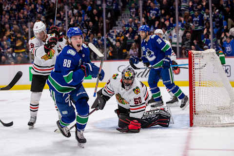 Adam Gaudette #88 of the Vancouver Canucks scores (Photo by Ben Nelms/Getty Images)