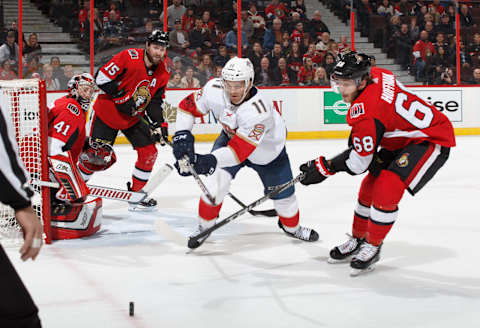 OTTAWA, ON – MARCH 29: Jonathan Huberdeau #11 of the Florida Panthers battles for a loose puck against Craig Anderson #41, Zack Smith #15 and Mike Hoffman #68 of the Ottawa Senators at Canadian Tire Centre on March 29, 2018 in Ottawa, Ontario, Canada. (Photo by Andre Ringuette/NHLI via Getty Images)