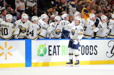 Mar 5, 2020; Buffalo, New York, USA; Buffalo Sabres defenseman Jake McCabe (19) celebrates his goal with teammates during the first period against the Pittsburgh Penguins at KeyBank Center. Mandatory Credit: Timothy T. Ludwig-USA TODAY Sports