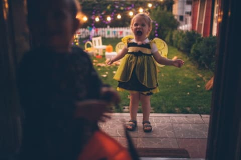 Little girl trick-or-treating.