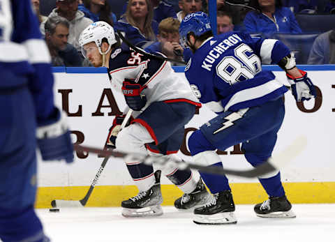 Jan 10, 2023; Tampa, Florida, USA; Columbus Blue Jackets center Jack Roslovic (96) skates with the puck as Tampa Bay Lightning right wing Nikita Kucherov (86) defends during the second period at Amalie Arena. Mandatory Credit: Kim Klement-USA TODAY Sports