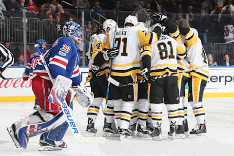 NEW YORK, NY – OCTOBER 17: Members of the Pittsburgh Penguins celebrate an overtime goal by Evgeni Malkin