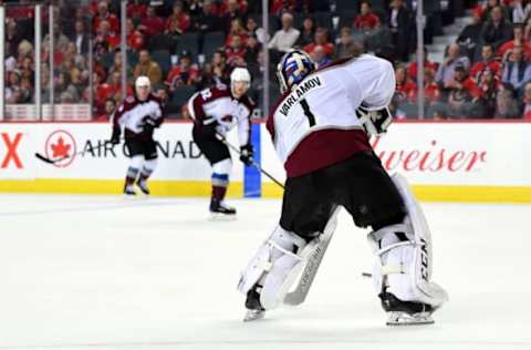 CALGARY, AB – JANUARY 09: Colorado Avalanche Goalie Semyon Varlamov (1) plays the puck to Left Wing Gabriel Landeskog (92) during the third period of an NHL game where the Calgary Flames hosted the Colorado Avalanche on January 9, 2019, at the Scotiabank Saddledome in Calgary, AB. (Photo by Brett Holmes/Icon Sportswire via Getty Images)