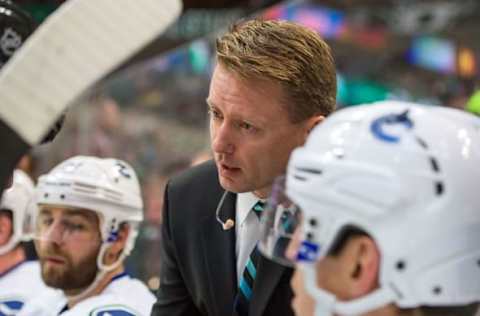 Oct 21, 2014; Dallas, TX, USA; Vancouver Canucks assistant coach Glen Gulutzan during the game against the Dallas Stars at the American Airlines Center. The Stars defeated the Canucks 6-3. Mandatory Credit: Jerome Miron-USA TODAY Sports