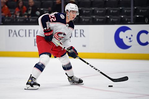 Apr 17, 2022; Anaheim, California, USA; Columbus Blue Jackets defenseman Jake Bean (22) moves in for a shot on goal against the Anaheim Ducks during the first period at Honda Center. Mandatory Credit: Gary A. Vasquez-USA TODAY Sports