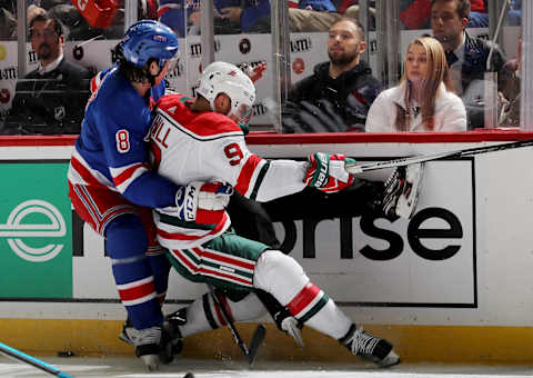 NEWARK, NEW JERSEY – NOVEMBER 30: Jacob Trouba #8 of the New York Rangers stops Taylor Hall #9 of the New Jersey Devils in the second period at Prudential Center on November 30, 2019 in Newark, New Jersey. (Photo by Elsa/Getty Images)