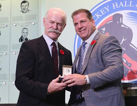 TORONTO, ON – NOVEMBER 10: Chairman of the Hockey Hall of Fame Lanny McDonald presents Mark Recchi with the Hall ring during a media opportunity at the Hockey Hall Of Fame and Museum on November 10, 2017 in Toronto, Canada. (Photo by Bruce Bennett/Getty Images)