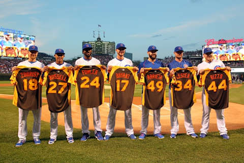 Jul 7, 2016; Chicago, IL, USA; Chicago Cubs second baseman Ben Zobrist (18), shortstop Addison Russell (27), center fielder Dexter Fowler (24), third baseman Kris Bryant (17), starting pitcher Jake Arrieta (49), starting pitcher Jon Lester (34), and first baseman Anthony Rizzo (44) are honored before the game against the Atlanta Braves with their All-Star jerseys at Wrigley Field. Mandatory Credit: Caylor Arnold-USA TODAY Sports