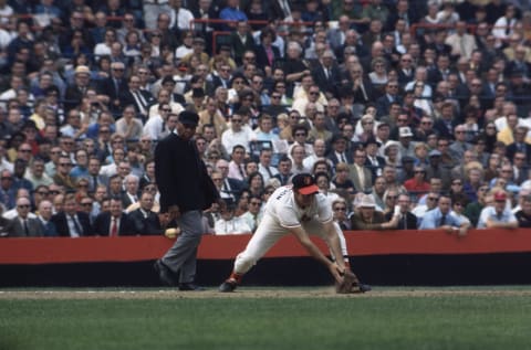 CINCINNATI – OCTOBER 1970: Orioles’ Brooks Robinson #5 fields a ground ball against the Cincinnati Reds during the 1970 World Series in Riverfront Stadium in Cincinnati, Ohio. (Photo by Focus On Sport/Getty Images)