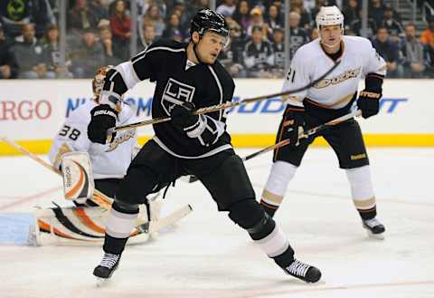 Apr 9, 2011; Los Angeles, CA, USA; Los Angeles Kings left wing Alexei Ponikarovsky (27) and Anaheim Ducks center Saku Koivu (11) position themselves in front of Anaheim Ducks goalie Dan Ellis (38) during the first period of the game at the Staples Center. Mandatory Credit: Jayne Kamin-Oncea-USA TODAY Sports