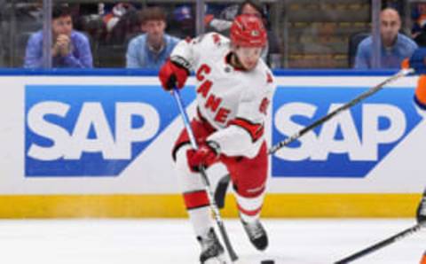 Apr 23, 2023; Elmont, New York, USA; Carolina Hurricanes center Jesperi Kotkaniemi (82) attempts a shot against the New York Islanders during the first period in game four of the first round of the 2023 Stanley Cup Playoffs at UBS Arena. Mandatory Credit: Dennis Schneidler-USA TODAY Sports