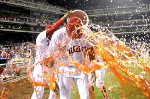 Jul 5, 2016; Philadelphia, PA, USA; Philadelphia Phillies starting pitcher Zach Eflin (56) gets Powerade dumped on him by right fielder Jimmy Paredes (41) and second baseman Andres Blanco (4) after beating the Atlanta Braves and picking up his first major league win at Citizens Bank Park. The Phillies defeated the Braves, 5-1. Mandatory Credit: Eric Hartline-USA TODAY Sports