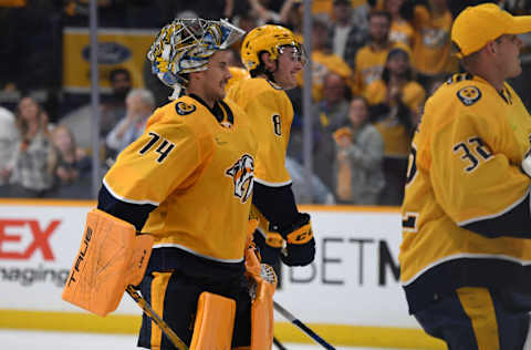 Nashville Predators goaltender Juuse Saros (74) celebrates with teammates after a shutout win against the Seattle Kraken at Bridgestone Arena. Mandatory Credit: Christopher Hanewinckel-USA TODAY Sports