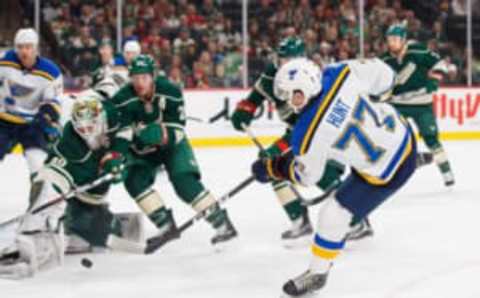 Dec 11, 2016; Saint Paul, MN, USA; St Louis Blues defenseman Brad Hunt (77) shoots in the first period against the Minnesota Wild goalie Devan Dubnyk (40) at Xcel Energy Center. Mandatory Credit: Brad Rempel-USA TODAY Sports