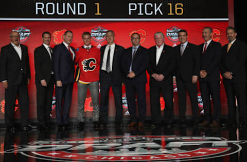 CHICAGO, IL – JUNE 23: (L-R) President and CEO Ken King, assistant general manager Craig Conroy, general manager Brad Treliving, 16th overall pick Juuso Valimaki, director of amateur scouting Tod Button, amateur scout Rob Sumner, president of hockey operations Brian Burke, assistant general manager Brad Pascall, pro scout Fred Parker and amateur scout Jim Cummins of the Calgary Flames pose for a photo onstag during Round One of the 2017 NHL Draft at United Center on June 23, 2017 in Chicago, Illinois. (Photo by Dave Sandford/NHLI via Getty Images)