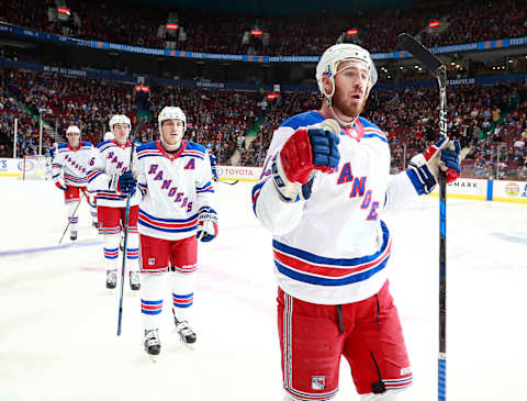 VANCOUVER, BC – FEBRUARY 28: Kevin Hayes #13 of the New York Rangers is congratulated by teammates after scoring during their NHL game against the Vancouver Canucks at Rogers Arena February 28, 2018 in Vancouver, British Columbia, Canada. (Photo by Jeff Vinnick/NHLI via Getty Images)”n