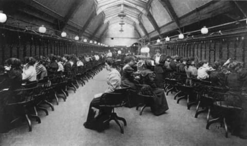 Switchboard operators at the Manchester Telephone Exchange, circa 1900.