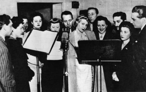 Eva Duarte (center, in 1944) made her name as a radio actress before marrying Juan Perón and becoming the First Lady of Argentina.