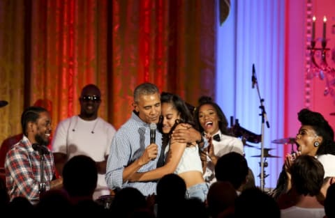 President Barack Obama hugs his daughter Malia Obama at the Fourth of July White House party on July 4, 2016. Maila celebrated her 18th birthday during the party, which featured guests including singers Janelle Monae and Kendrick Lamar.