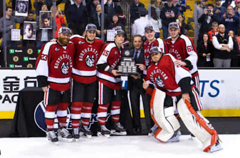 BOSTON, MA – March 19: Kevin Roy #15, Colton Saucerman #23, Dustin Darou #47, Mike McMurtry #7, Jarrett Fennell #61 and Derick Roy #1 all of the Northeastern Huskies pose with the Lamoriello Trophy as they celebrate a 3-2 victory against the Massachusetts Lowell River Hawks during the Hockey East Championship Final at TD Garden on March 19, 2016 in Boston, Massachusetts. (Photo by Richard T Gagnon/Getty Images)