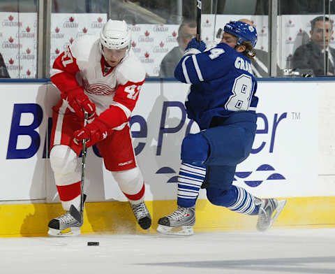 Mikhail Grabovski #84 of the Toronto Maple Leafs misses a hit on Evan McGrath #47 of the Detroit Red Wings in a pre-season game on September 26, 2009 at the Air Canada Centre in Toronto, Ontario.(Photo by Claus Andersen/Getty Images)