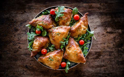 samosas on greens